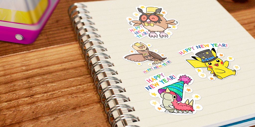 Quatro adesivos Pokemon Go New Year's 2023 diferentes em uma página de notebook