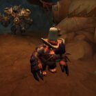 WoW Ponzo is wearing a hat with a green snail behind him