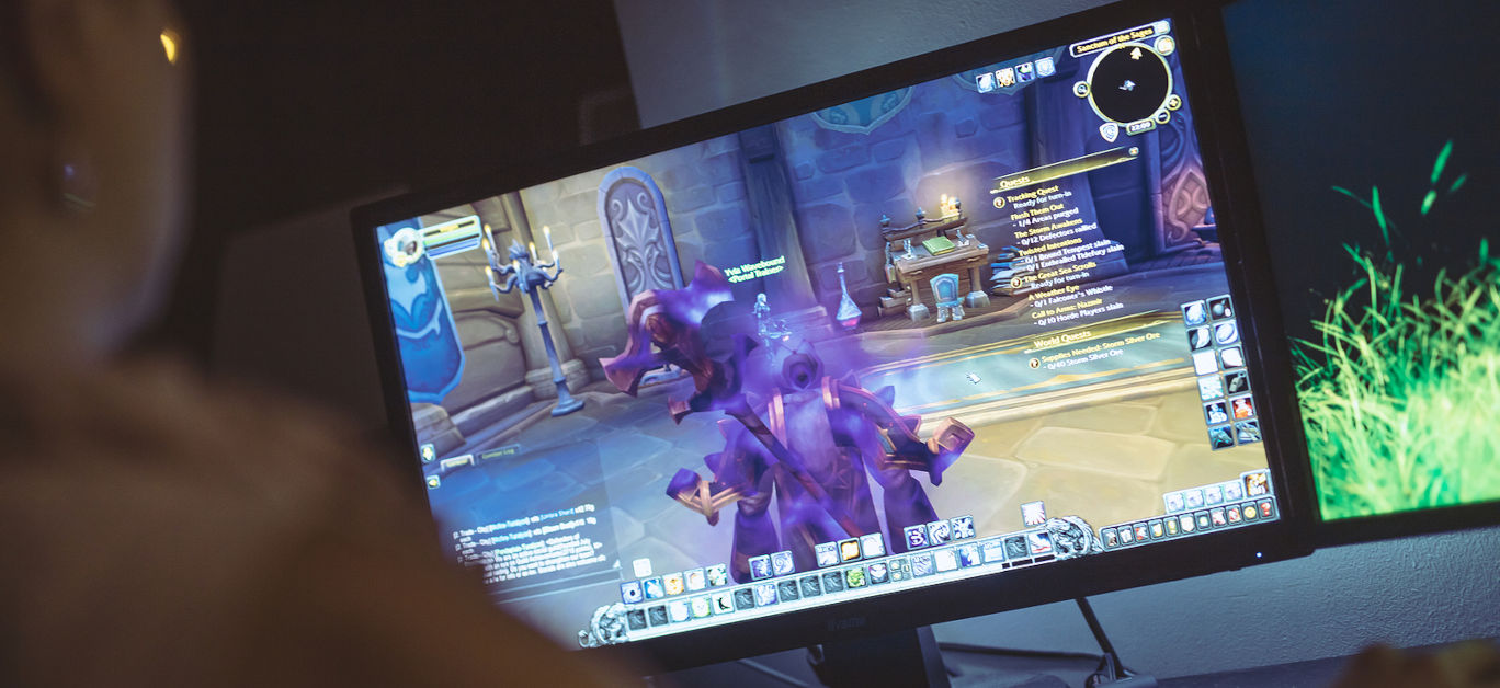Woman playing World of Warcraft: Battle of Azeroth game